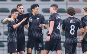 Chris Wood (2nd from left) celebrates scoring a goal against Gambia in Dubai.