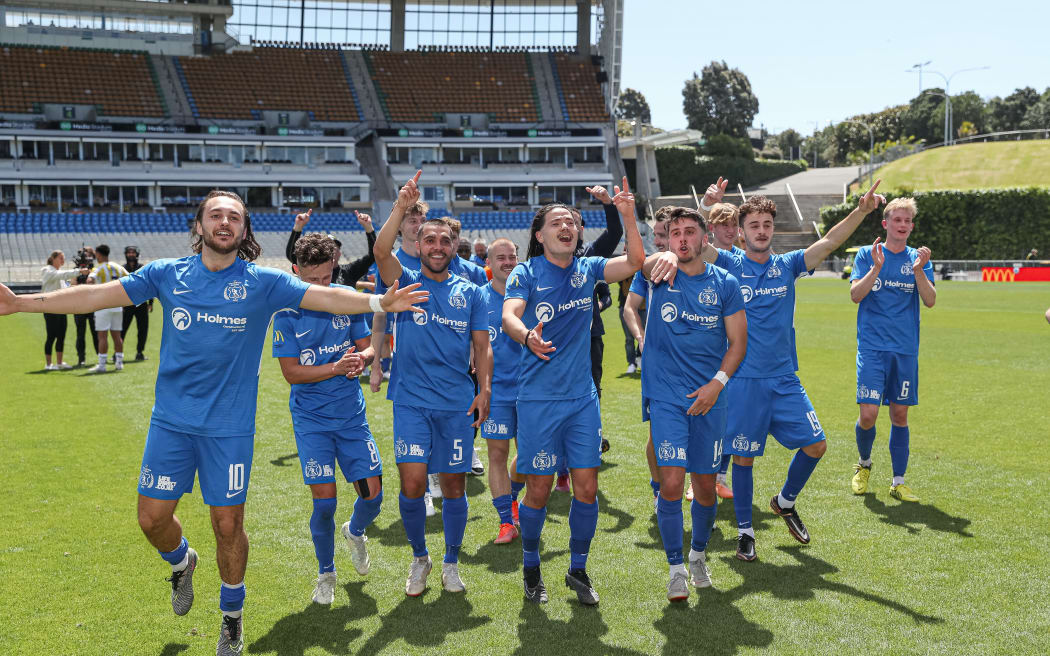 Wellington Olympic players celebrate winning the National League Championship final against Auckland City FC.