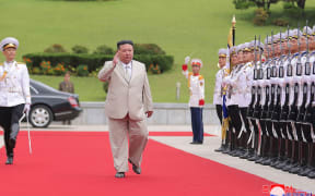 This picture taken on August 27, 2023 and released from North Korea's official Korean Central News Agency (KCNA) on August 29, 2023 shows North Korea's leader Kim Jong Un (C) saluting an honour guard as he visits the Naval Command of the Korean People's Army to mark Navy Day, at an undisclosed location in North Korea. (Photo by KCNA VIA KNS / AFP) / South Korea OUT / REPUBLIC OF KOREA OUT
---EDITORS NOTE--- RESTRICTED TO EDITORIAL USE - MANDATORY CREDIT "AFP PHOTO/KCNA VIA KNS" - NO MARKETING NO ADVERTISING CAMPAIGNS - DISTRIBUTED AS A SERVICE TO CLIENTS / THIS PICTURE WAS MADE AVAILABLE BY A THIRD PARTY. AFP CAN NOT INDEPENDENTLY VERIFY THE AUTHENTICITY, LOCATION, DATE AND CONTENT OF THIS IMAGE --- /