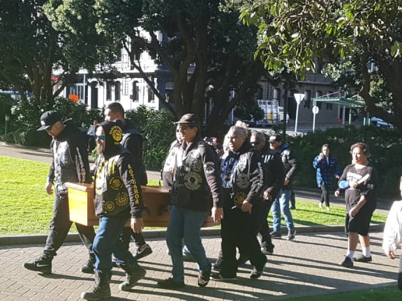 Reitu Harris's body is carried to the steps of Parliament for a haka.