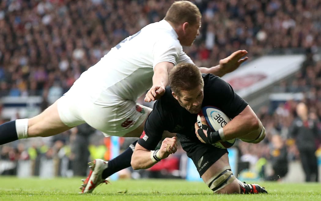 Dylan Hartley tries to tackle All Blacks captain Richie McCaw in the 2014 test at Twickenham.