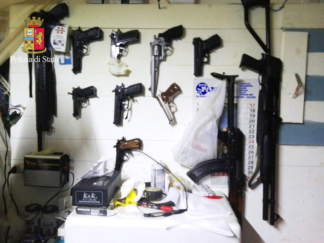 A picture released by the Italian police showing arms found during the anti-mafia operation.