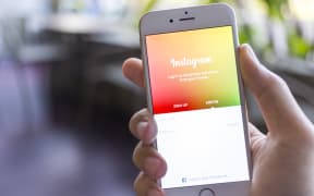 CHIANG MAI, THAILAND - JANUARY 02, 2015: A man trying to log in Instagram application using Apple iPhone 6. Instagram is largest and most popular photograph social networking site in the world.