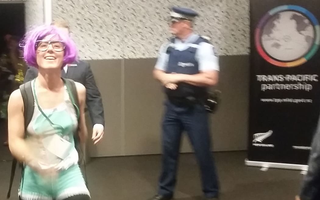 A protestor leaves the government's TPP roadshow at the Rendezvous Hotel in Auckland.