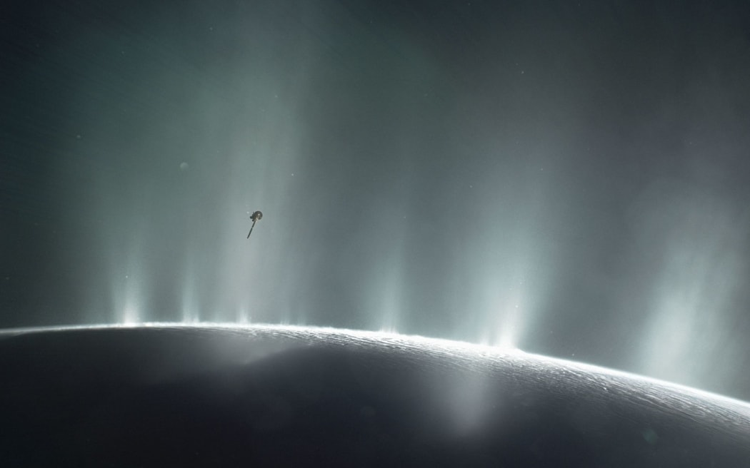This illustration shows Cassini diving through the Enceladus plume in 2015.