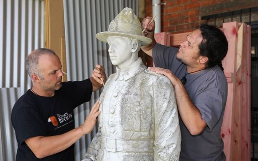 Statue of Warrant Officer Class II. Sergeant Major, Herewini Whakarua.
Marco Buerger and Aaron Te Rangiao from Goldfield Stone, working on the statue.