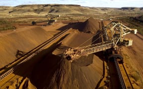 A Rio Tinto reclaimer working in the Yandicoogina stockyard in Western Australia's Pilbara region.