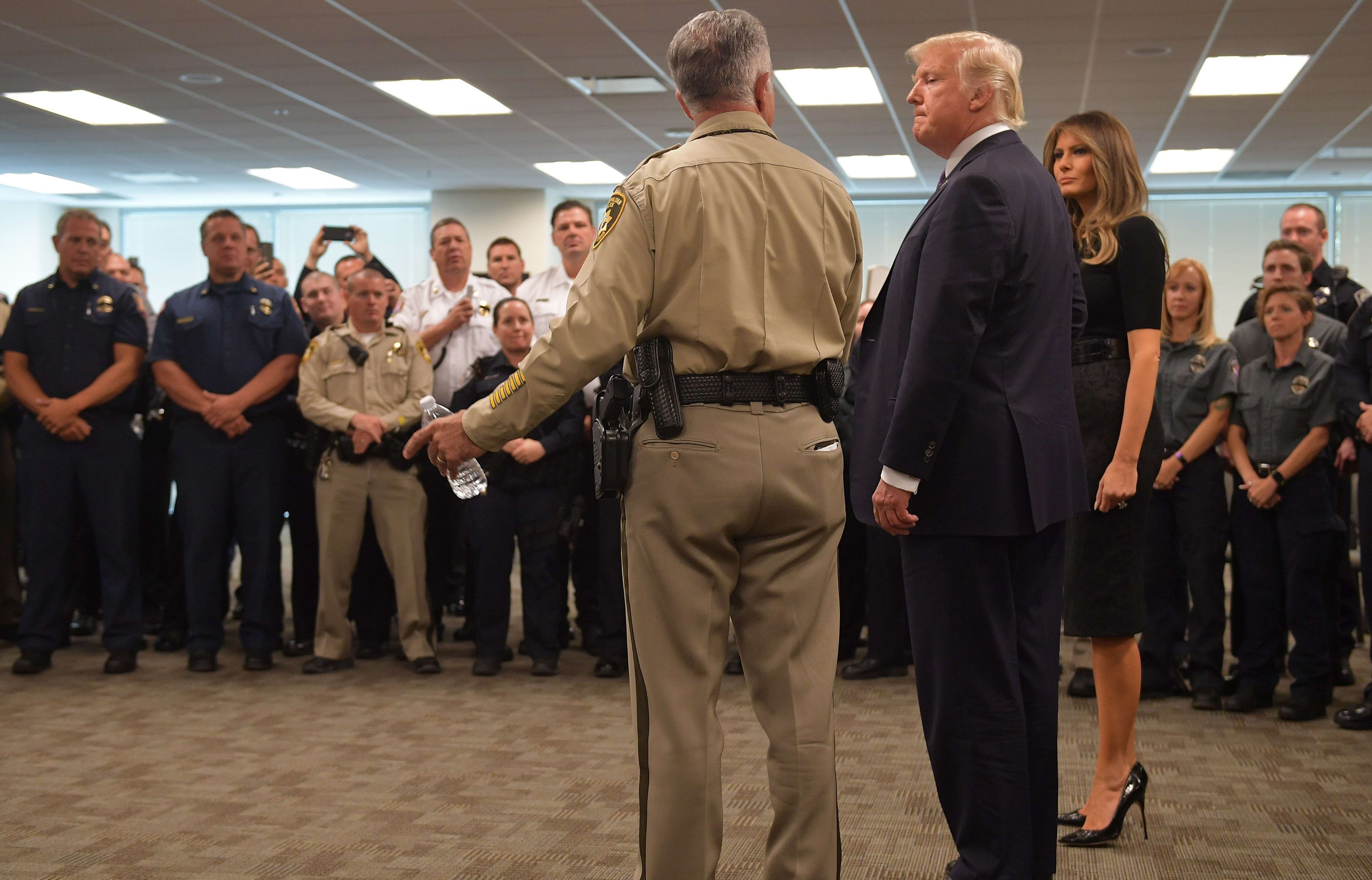 Donald Trump and Melania Trump meet with police and first responders in Las Vegas following the attack.