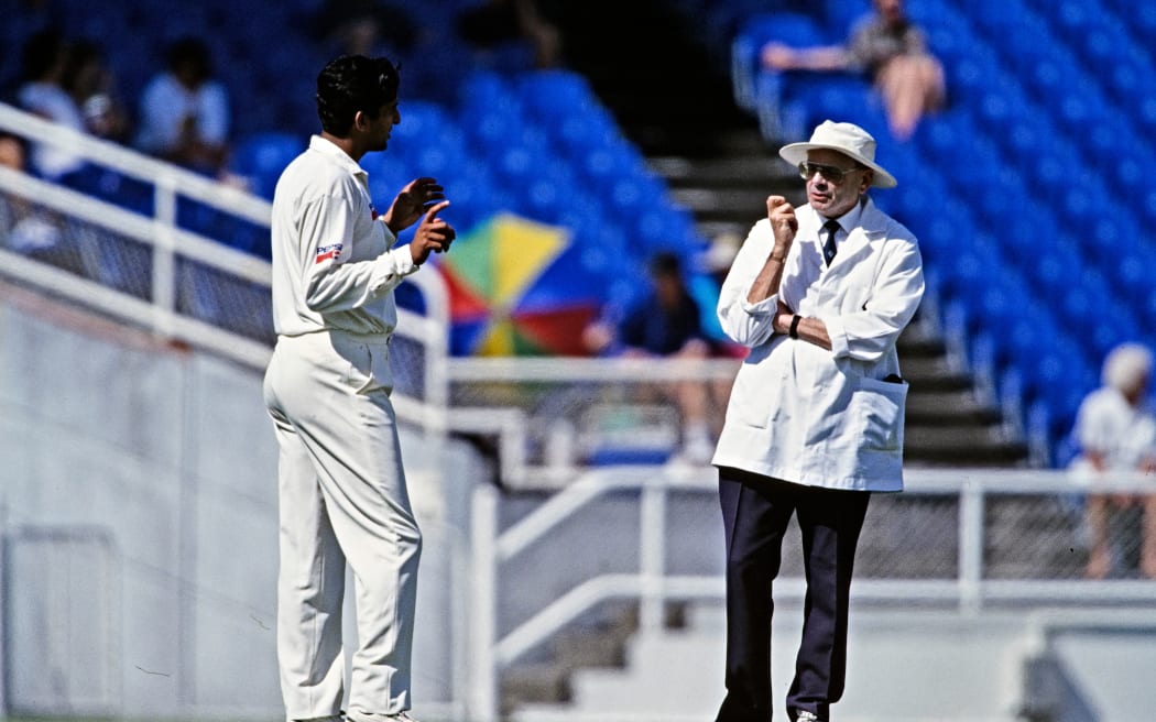 Pakistan cricketer Wasim Akram speaks to umpire Dickie Bird, Eden Park, 1994.