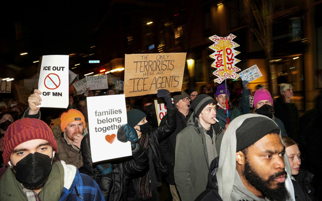 People march during a demonstration against increased immigration enforcement, days after the fatal shooting of Renee Nicole Good by a US Immigration and Customs Enforcement (ICE) agent, in Minneapolis, Minnesota on January 9, 2026.