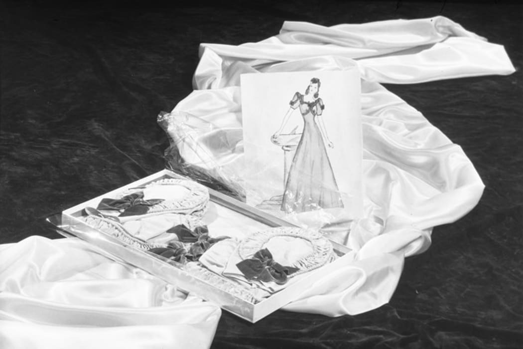 Photo of a boxed Ninette Gowns dress and illustration, 1939.