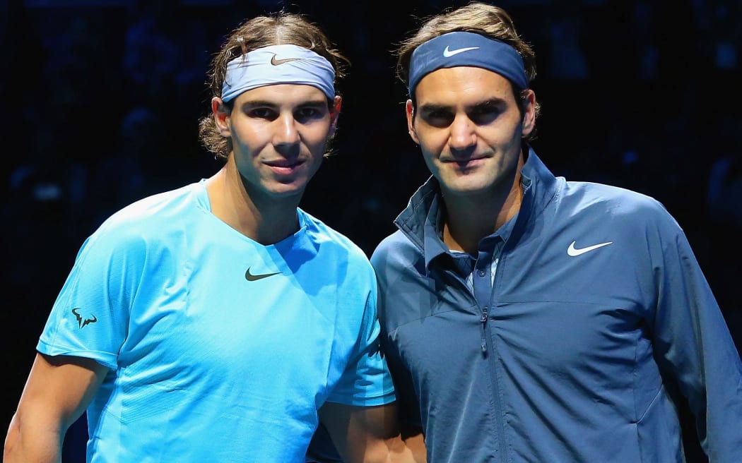 Rafael Nadal and Roger Federer pose together at the World Tour Finals in London, 2013.
