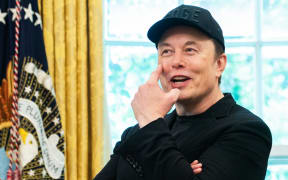Elon Musk gestures to his eye during a news conference with US President Donald Trump in the Oval Office of the White House in Washington, DC, on 30 May. 2025. Musk, who stormed into US politics as President Trump's chainsaw-brandishing sidekick, announced on May 28 that he is leaving his role in US government, intended to reduce federal spending, shortly after his first major break with the President over Trump's signature spending bill. (Photo by Allison ROBBERT / AFP)