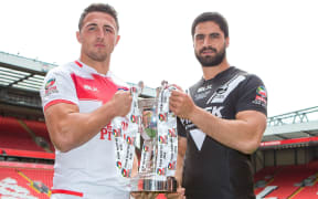 Sam Burgess and Jesse Bromwich hold the Four Nations trophy.