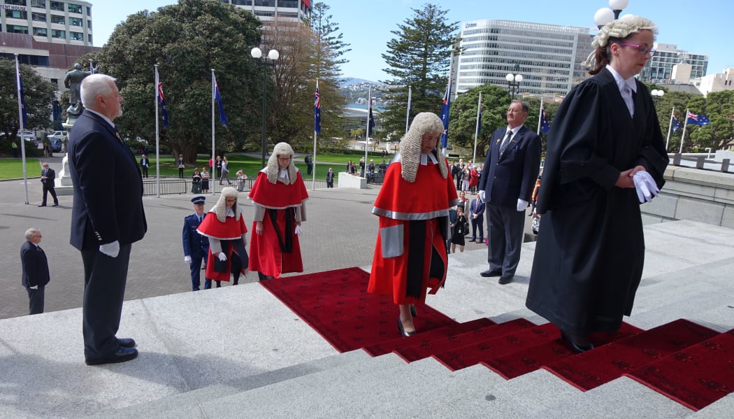 Royal Commissioners being led by the Sheriff of the High Court up the steps of Parliament to the Commission opening of Parliament.