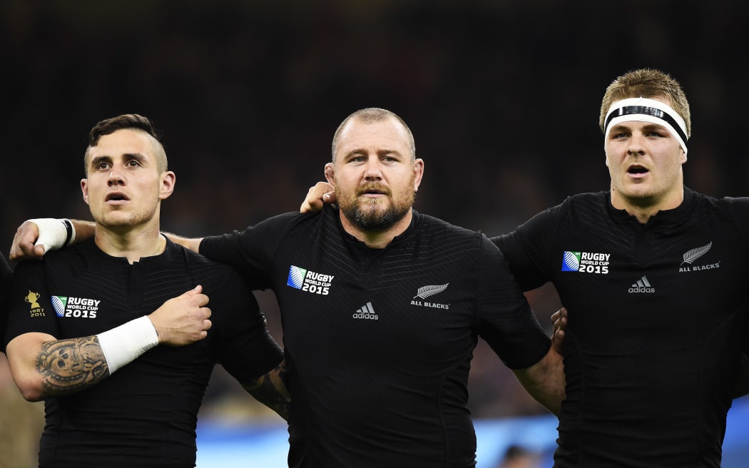 TJ Perenara, Tony Woodcock and Sam Cane line up for the national anthem ahead of the New Zealand All Blacks v Georgia Rugby World Cup 2015 match. Millennium Stadium in Cardiff, Wales, UK. Friday 2 October 2015. Copyright Photo: Andrew Cornaga / www.Photosport.nz