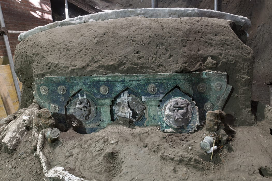 A large Roman four-wheeled ceremonial chariot after it was discovered near the The archaeological park of Pompeii.