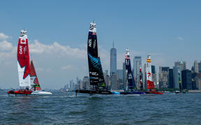 France SailGP Team helmed by Quentin Delapierre lead Canada SailGP Team helmed by Phil Robertson and New Zealand SailGP Team helmed by Peter Burling as they sail past the New York City skyline during a practice session ahead of the Mubadala New York Sail Grand Prix in New York, USA. Friday 21st June 2024. Photo: Ricardo Pinto for SailGP. Handout image supplied by SailGP
