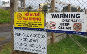 Warning signs have been put up at a New Plymouth beach and residents of a nearby suburb told not to flush their toilets after a sewage spill in the city last night.