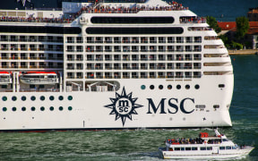 Detail of MSC cruise ship moving through San Marco canal in Venice, Italy. MSC is the world's second largest shipping line in terms of container vessel capacity and also owns 12 cruise ships.