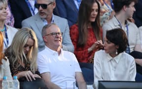 Australian Prime Minister Anthony Albanese looks on prior to the men's singles final match between Russia's Daniil Medvedev and Italy's Jannik Sinner on day 15 of the Australian Open tennis tournament in Melbourne on January 28, 2024. (Photo by Martin KEEP / AFP)