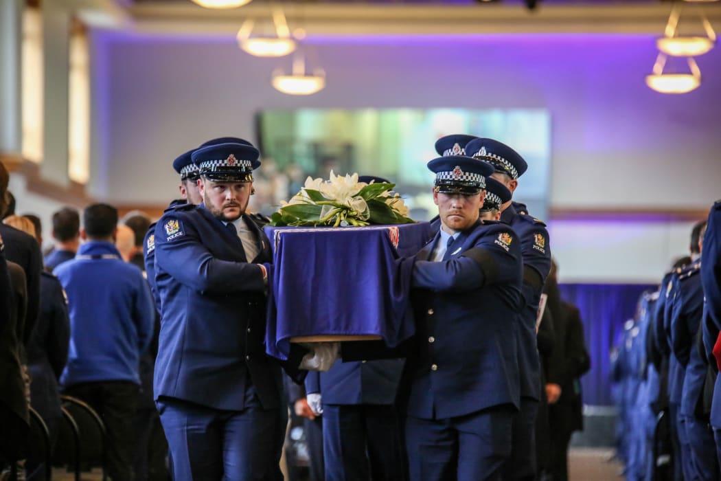 Police colleagues carry the casket of Constable Matthew Hunt at his funeral on 9 July.
