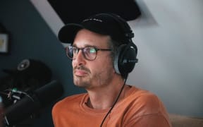 New Zealand journalist David Farrier recording an episode of the podcast Armchaired & Dangerous