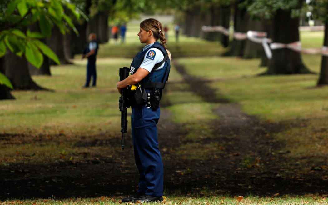 Police officers guard the area close to the Masjid al Noor mosque after the terror attack.