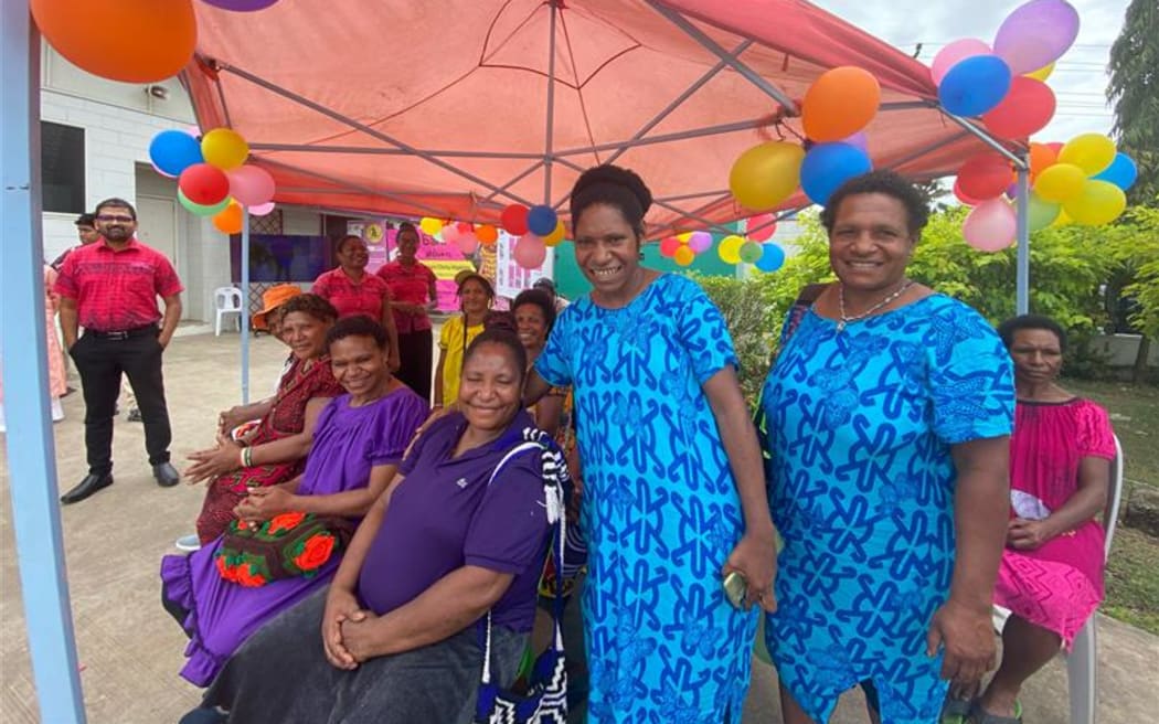 Women at Gordon's Market PNG greet New Zealand prime minister. NZ funds the market which is a safe place for women, through the UN Women Safe Cities Programme.