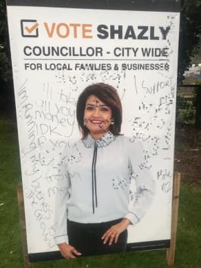 Hutt City council candidate's billboards scrawled with racist slogans | RNZ