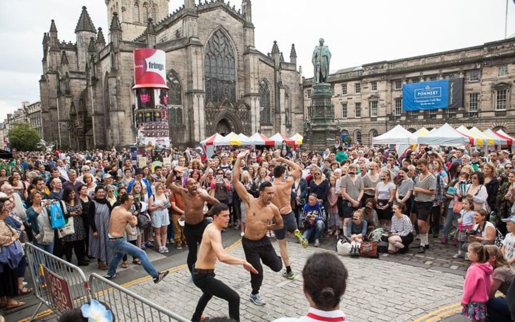 Black Grace performs for crowds on Edinburgh's Royal Mile.