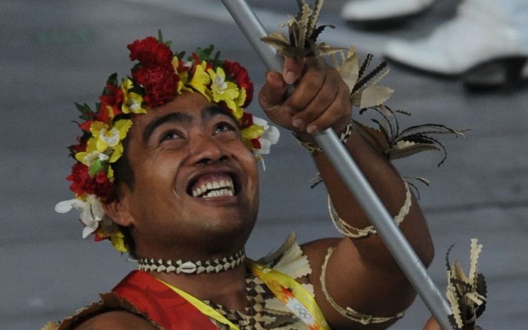 Commonwealth gold medalist David Katoatau flies the Kiribati flag.