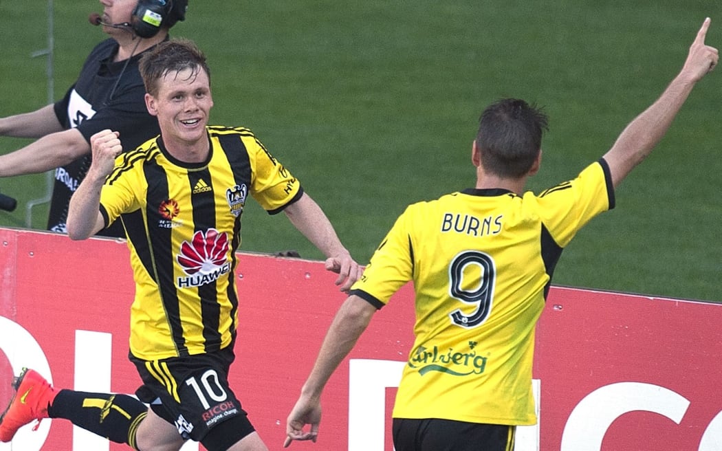 Michael McGlinchey (L) of the Phoenix celebrates a goal with team mate Nathan Burns.