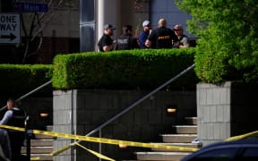 LOUISVILLE, KY - APRIL 10: Law enforcement officers gather outside the front entrance of the Old National Bank building after a gunman opened fire on April 10, 2023 in Louisville, Kentucky. According to reports, there are multiple fatalities and injuries. The shooter died at the scene.   Luke Sharrett/Getty Images/AFP (Photo by LUKE SHARRETT / GETTY IMAGES NORTH AMERICA / Getty Images via AFP)