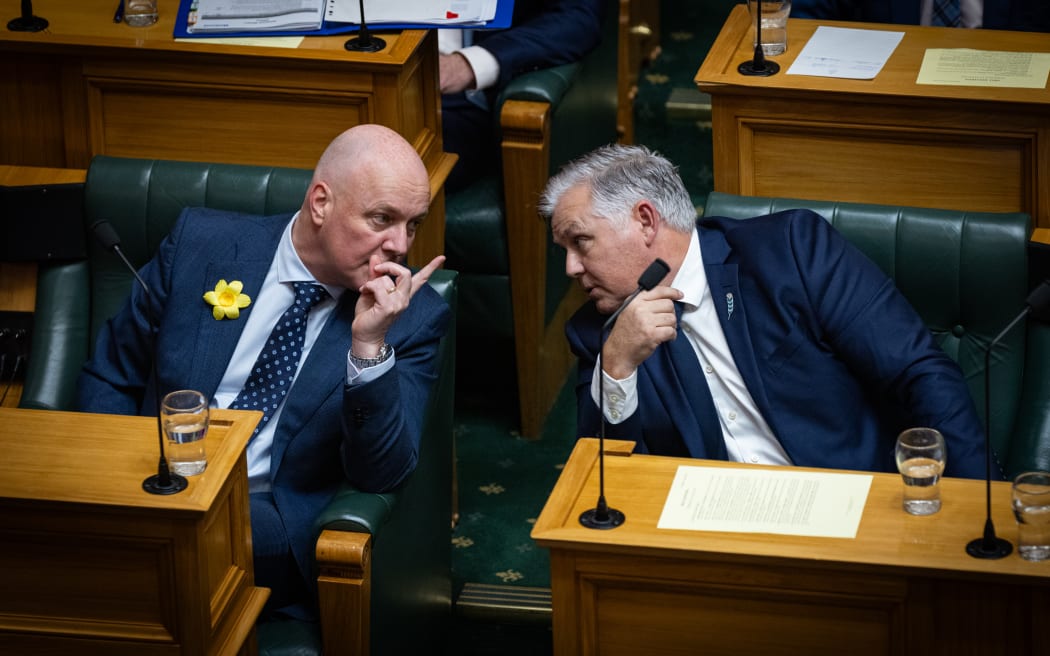 Mark Mitchell appears to brief Christopher Luxon on the name suppression order that Rawiri Waititi has alluded to during a question that ACT's David Seymour has taken issue with.