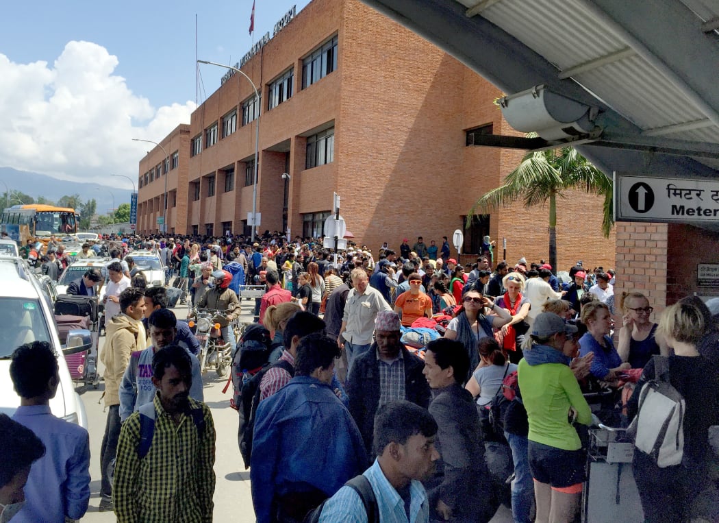 Tourists crowd Kathmandu airport waiting for a flight out. 27 April