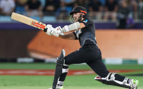Captain Kane Williamson of New Zealand hits a six during the ICC Men's T20 World Cup final cricket match between Australia and New Zealand at Dubai International Cricket Stadium