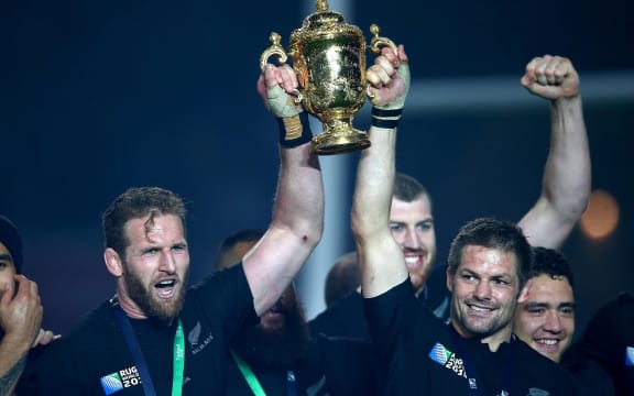 All Blacks Kieran Read, left, and Richie McCaw lift the Webb Ellis Cup.