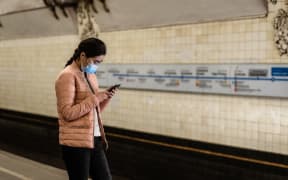 A girl wearing medical mask in the metro of Moscow. Moscow, march 2020.