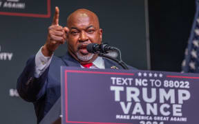 ASHEVILLE, NORTH CAROLINA - AUGUST 14: Mark Robinson, Lieutenant Governor of North Carolina and candidate for Governor, delivers remarks prior to Republican presidential nominee former President Donald Trump speaking at a campaign event at Harrah's Cherokee Center on August 14, 2024 in Asheville, North Carolina. Trump will speak on the economy as Vice President Kamala Harris surges in the polls in swing states.   Grant Baldwin/Getty Images/AFP (Photo by Grant Baldwin / GETTY IMAGES NORTH AMERICA / Getty Images via AFP)
