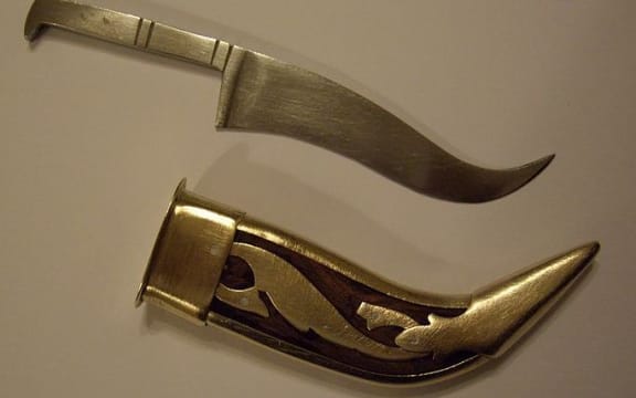 A kirpan and sheath