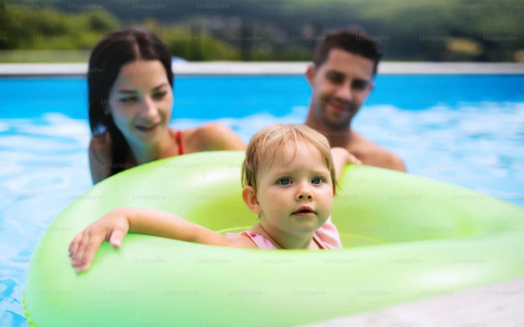 A child learning to swim.