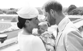 e Duke and Duchess of Sussex shows Britain's Prince Harry, Duke of Sussex (R), and his wife Meghan, Duchess of Sussex holding their baby son, Archie Harrison Mountbatten-Windsor at Windsor Castle on July 6, 2019.