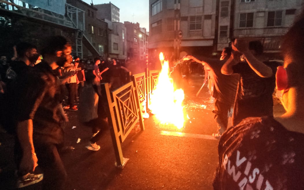 Dozens of people stage a demonstration to protest the death of a 22-year-old woman under custody in Tehran Iran on September 21, 2022.