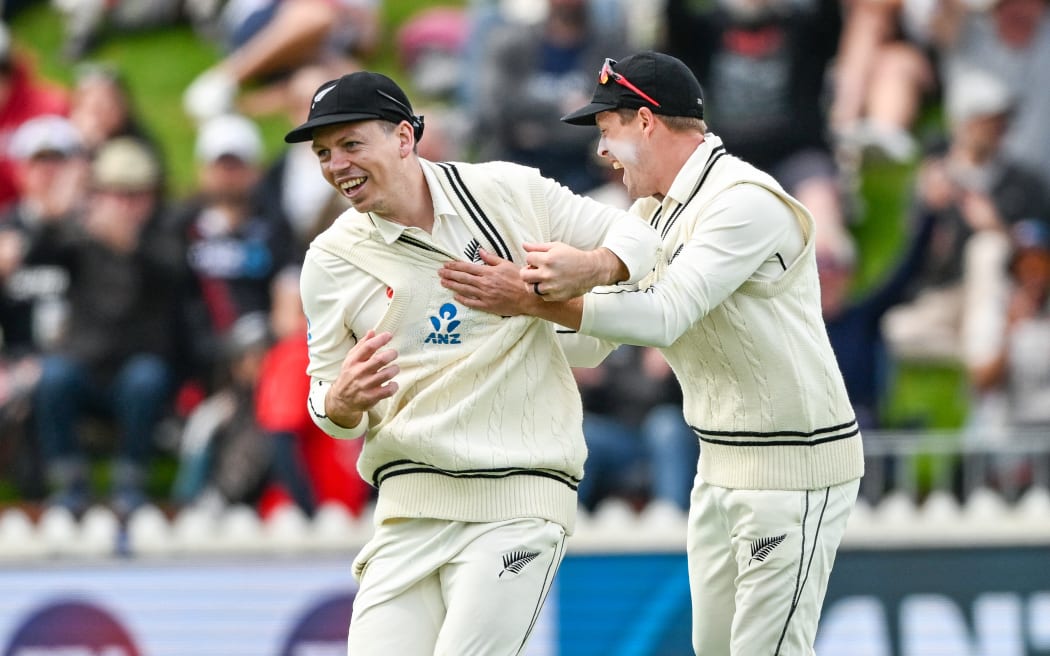 Michael Bracewell (L) celebrates an England wicket falling during a test at Wellington's Basin Reserve.