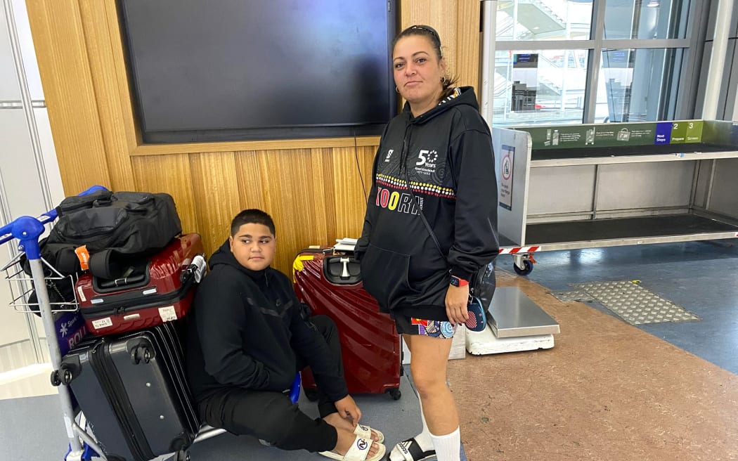 Auckland International Airport - flights canned due to Cyclone Gabrielle - Jaye Lee Snowden and her son Braxton Stoker