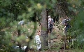 Police search an allotment in the Hanover suburb of Seelze in their investigation of the disappearance of British toddler Madeleine McCann.