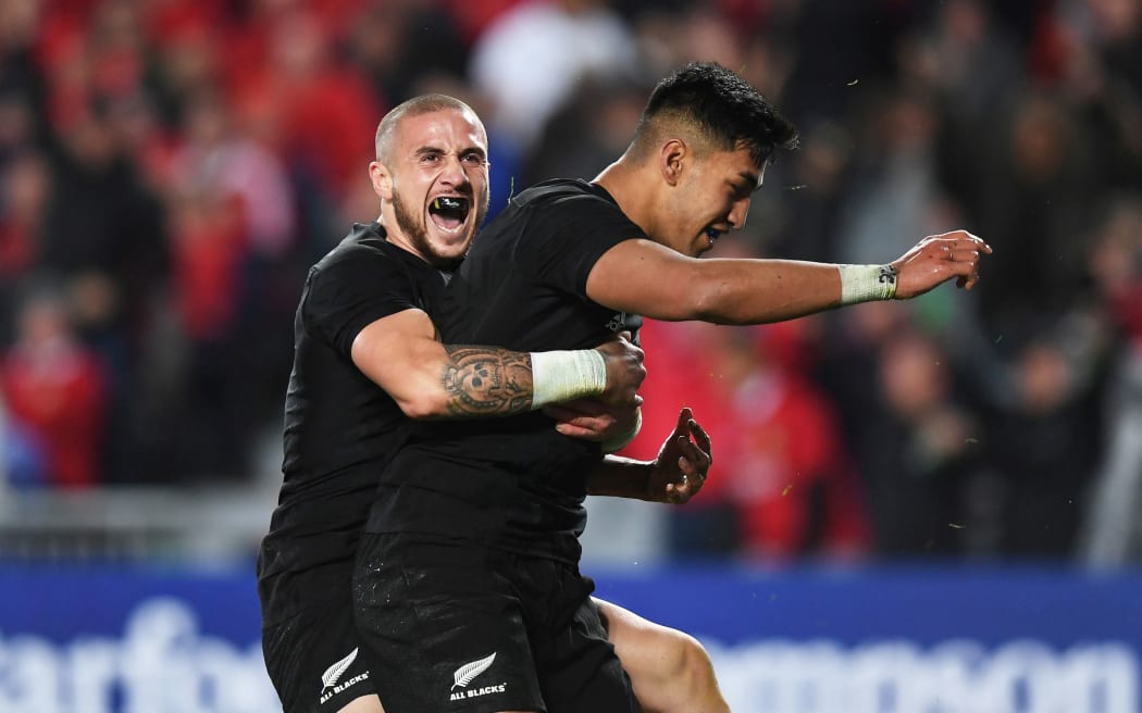Rieko Ioane after scoring his second try, celebrating with TJ Perenara.
