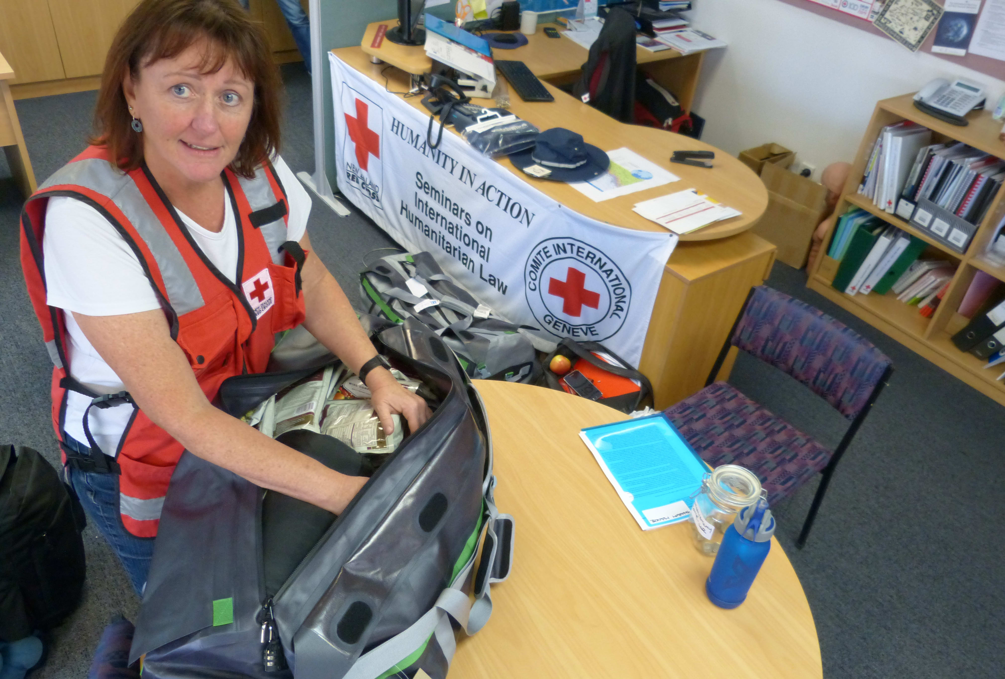 Volunteer nurse Donna Collins prepares her gear to head to Kathmandu.