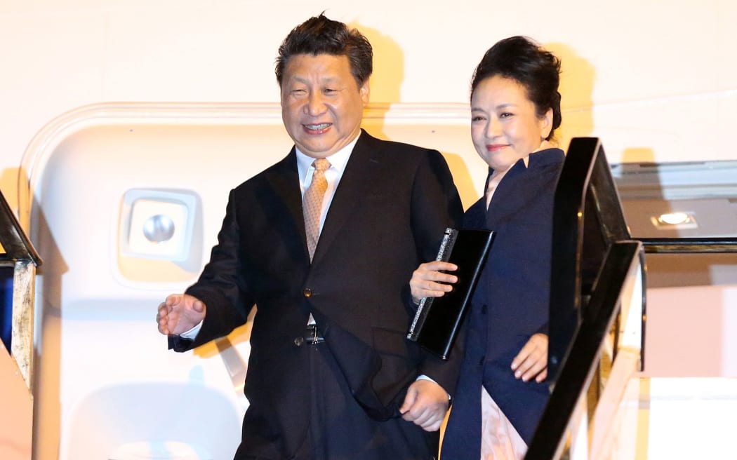Xi Jinping and his wife Peng Liyuan as they arrived at Auckland International Airport.